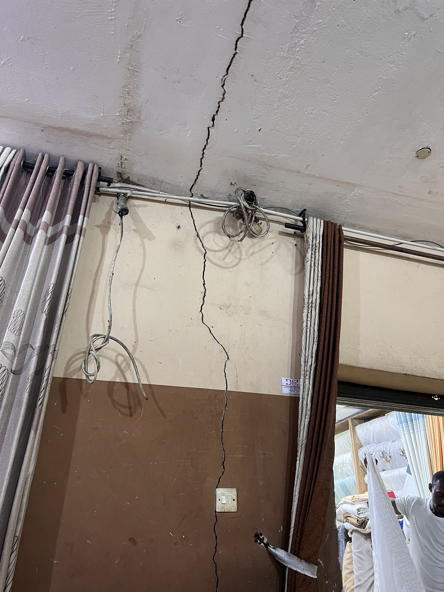 Twitter user raises alarm over visible crack on the wall of a popular Lagos market shares photo and video